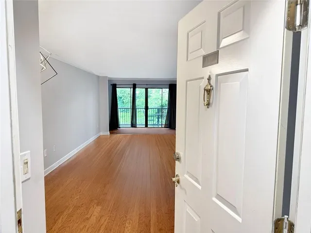a kitchen with a refrigerator and a sink