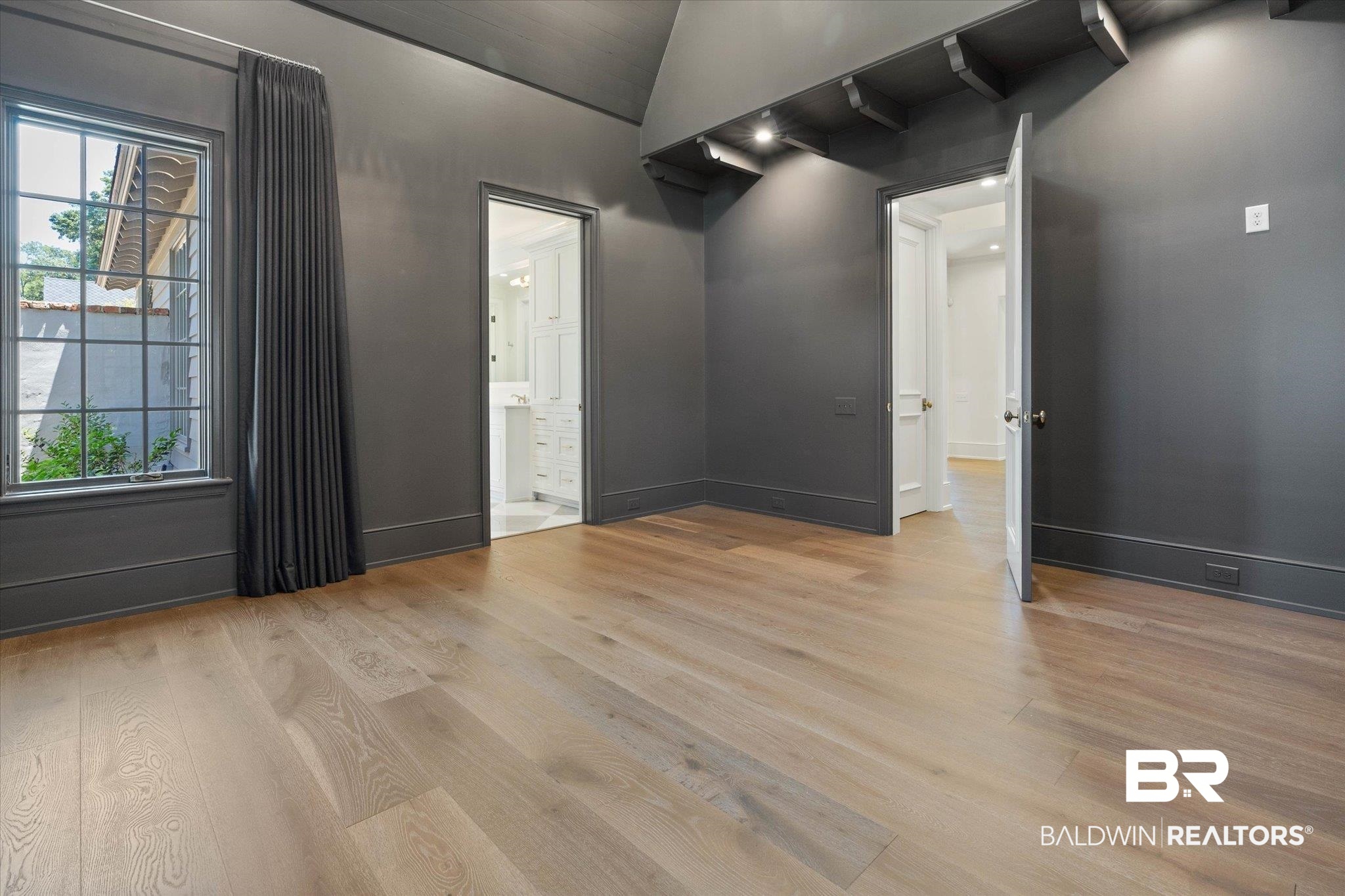 3 Canterbury Park Mobile, AL 36608 - Photo 17 of 43 Spare room featuring light wood-style flooring, plenty of natural light, and baseboards