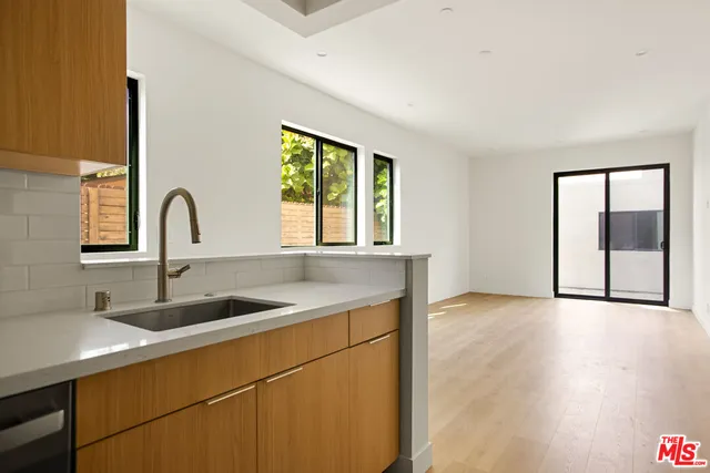 a kitchen with a sink and a window