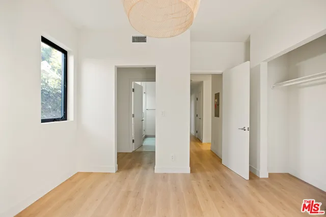 a bathroom with a granite countertop sink a mirror and a