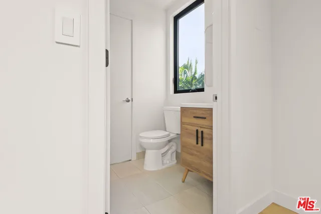 a bathroom with a shower and a mirror