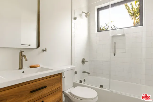 a bathroom with a bathtub toilet and sink