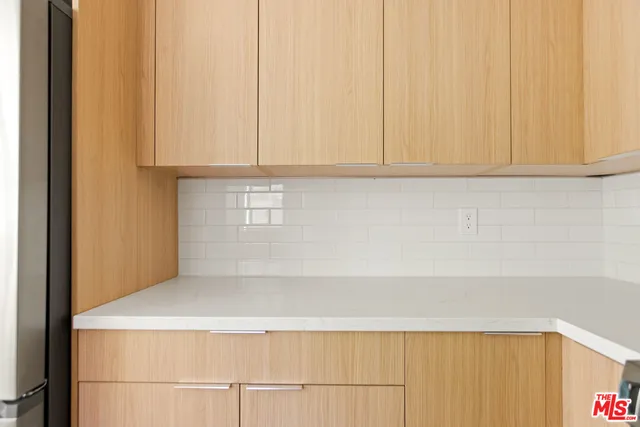 a view of a storage & utility room with a washer dryer