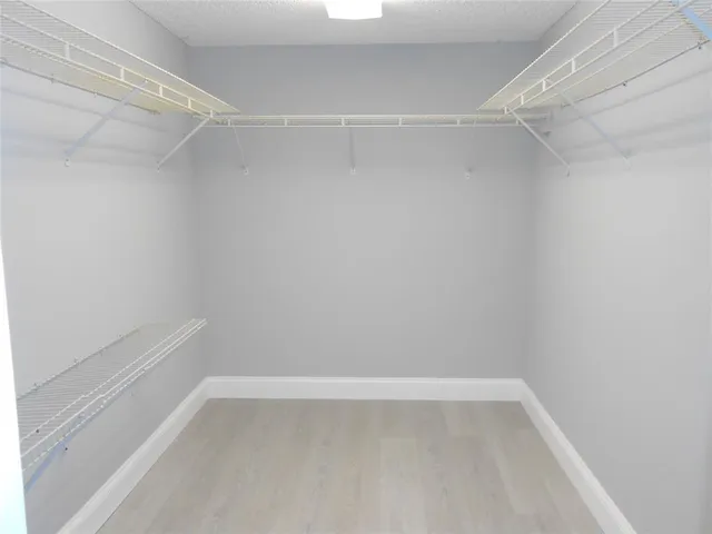 a view of an empty walk in closet