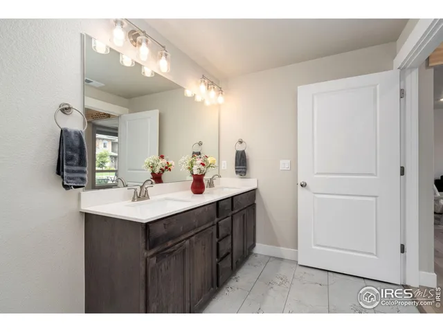 a bathroom with a sink a mirror and a toilet