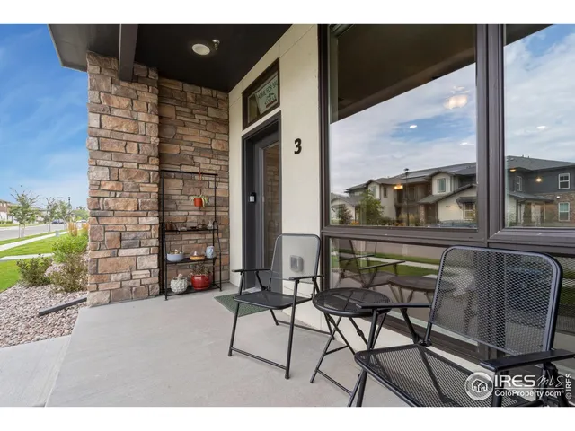a picture of table and chairs in the balcony