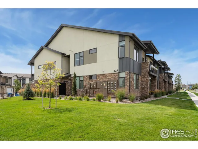 a front view of building with yard