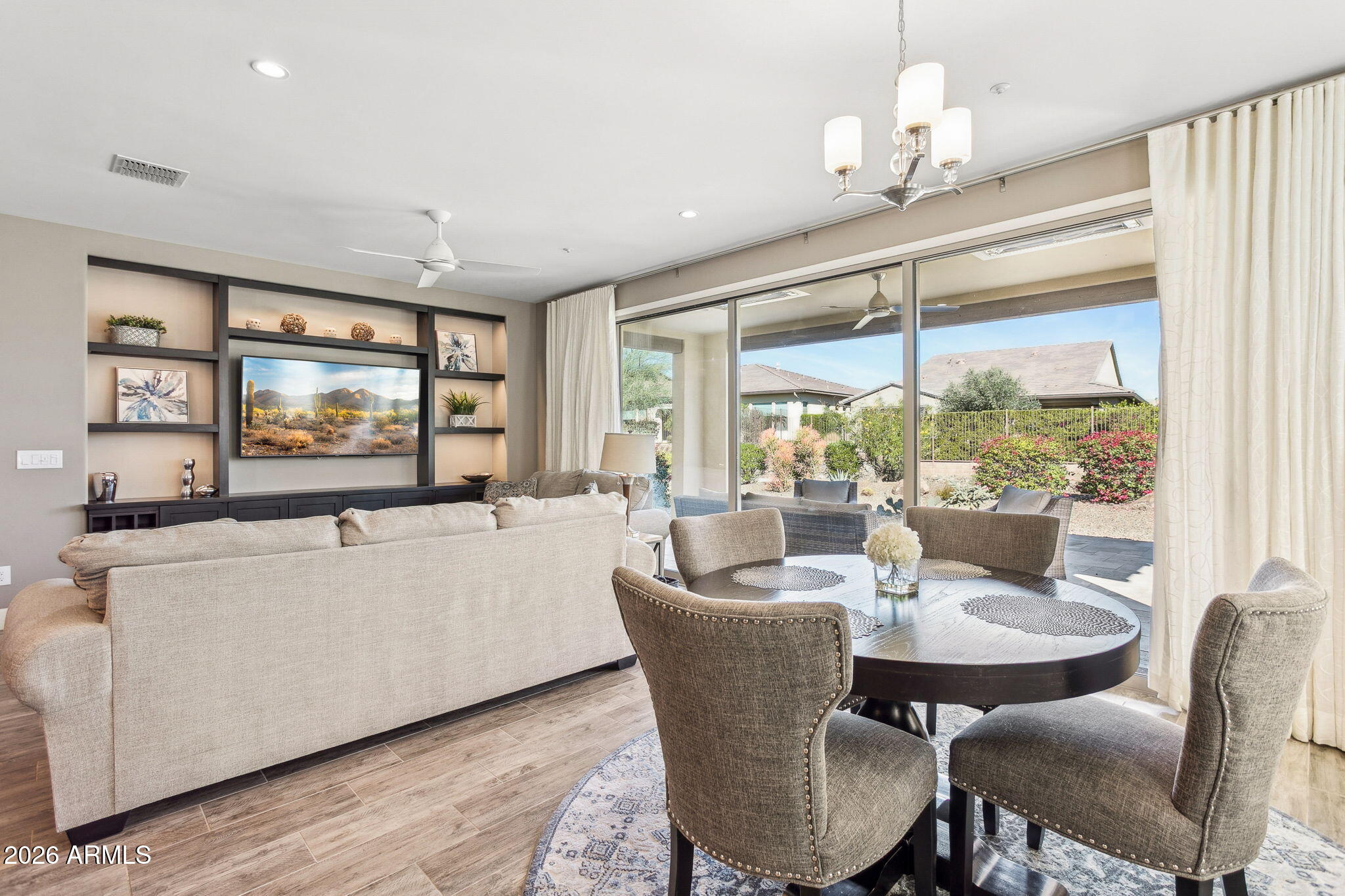 17660 East Fort Verde Road Rio Verde, AZ 85263 - Photo 13 of 56 a living room with furniture a large window and a dining table