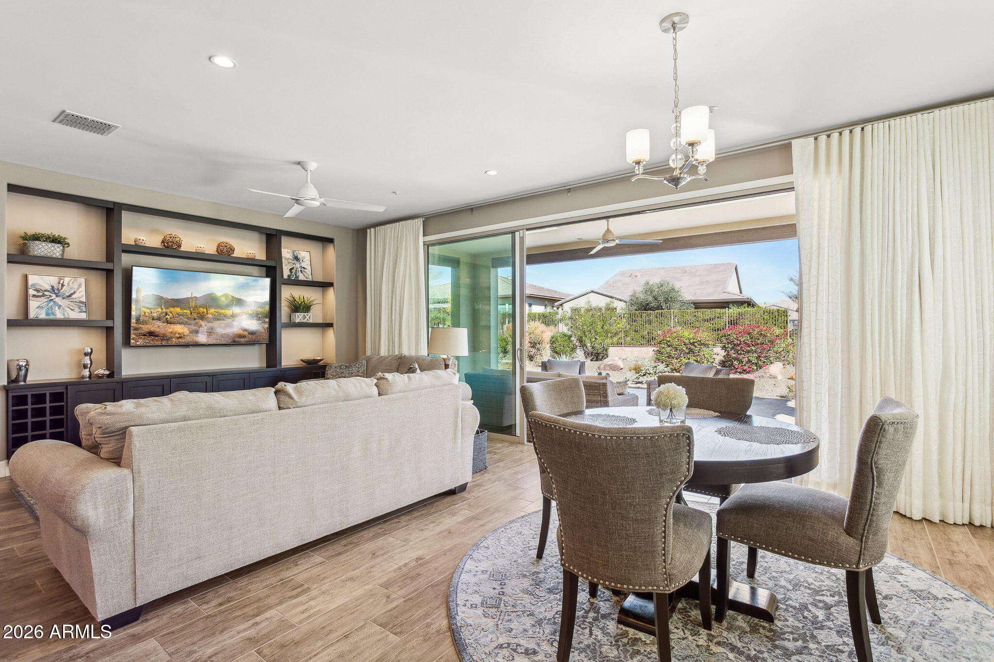 17660 East Fort Verde Road Rio Verde, AZ 85263 - Photo 18 of 56 a living room with furniture a large window and a flat screen tv