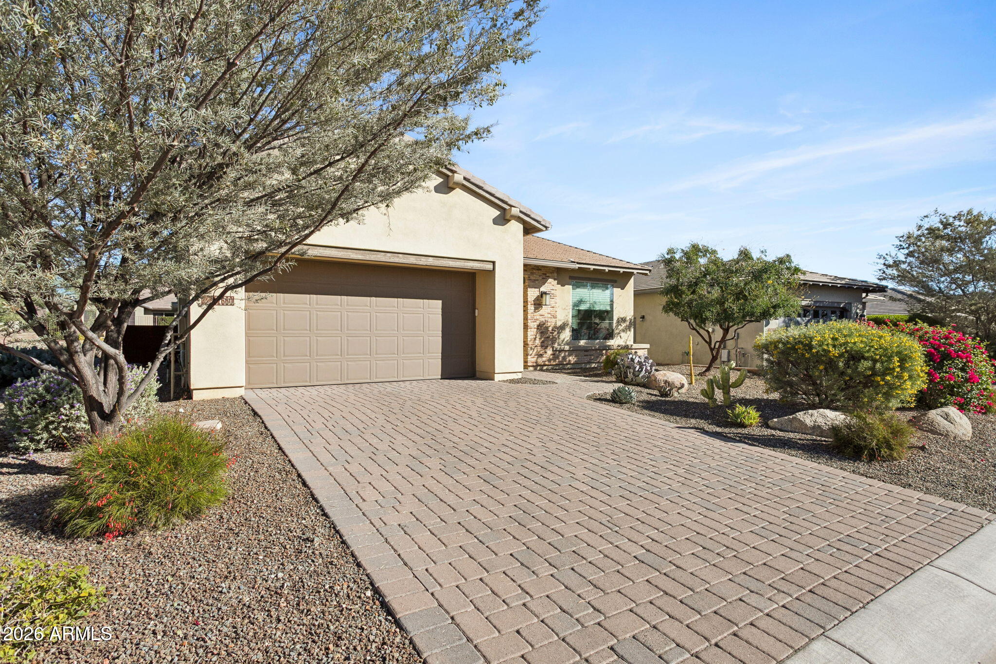 17660 East Fort Verde Road Rio Verde, AZ 85263 - Photo 2 of 56 a front view of a house with a yard and garage