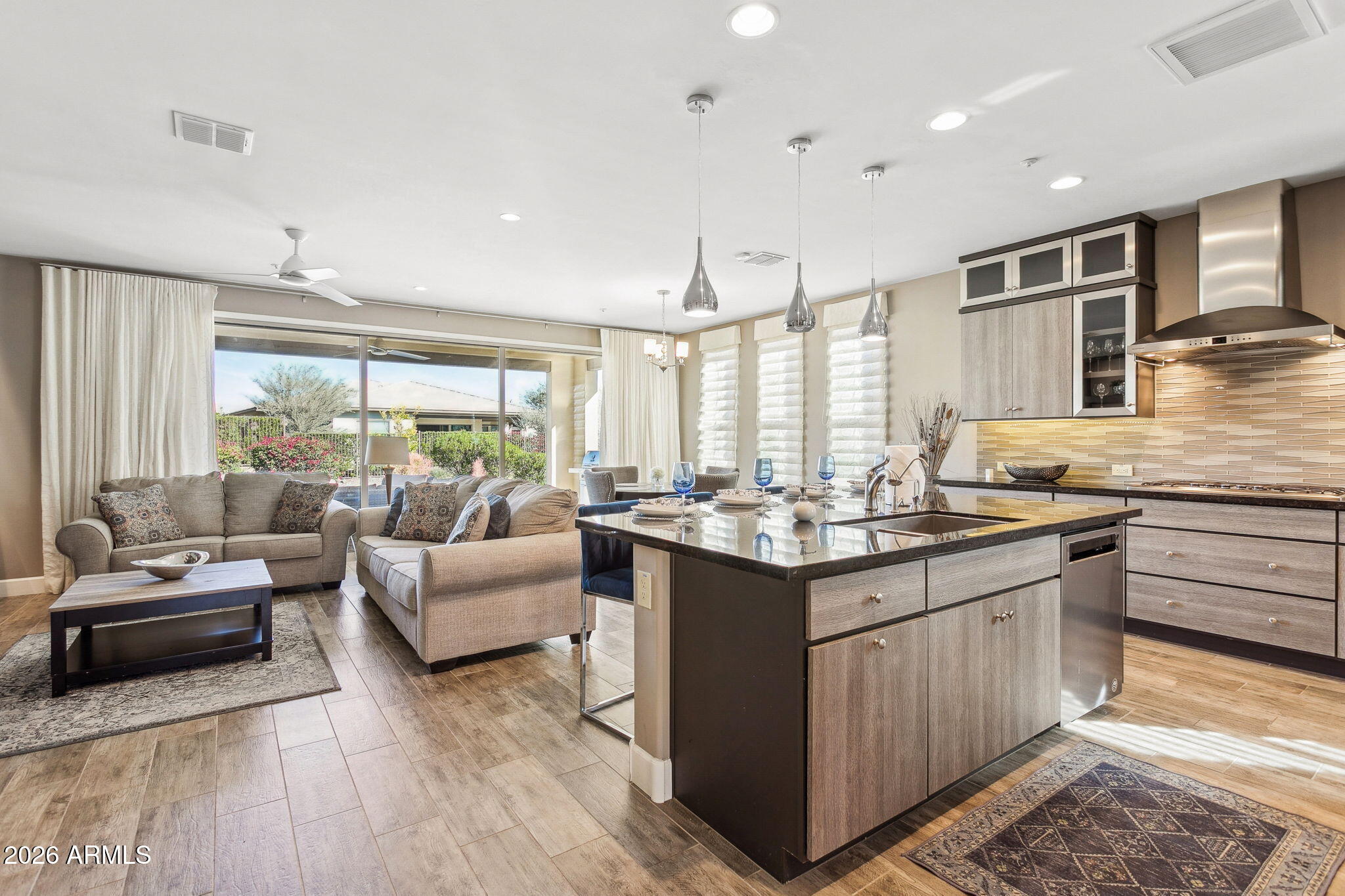 17660 East Fort Verde Road Rio Verde, AZ 85263 - Photo 7 of 56 a kitchen with stainless steel appliances granite countertop a stove and a view of living room