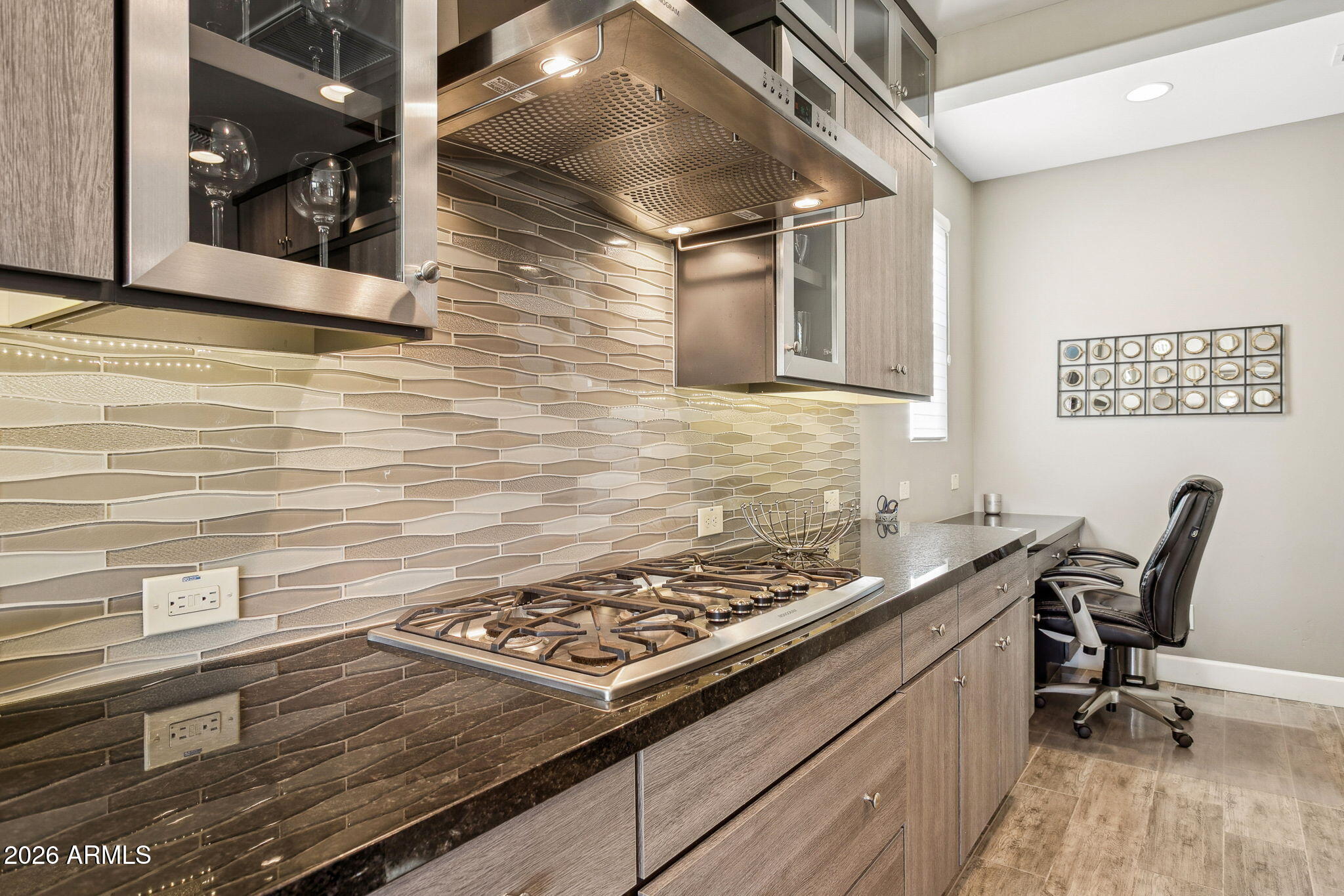 17660 East Fort Verde Road Rio Verde, AZ 85263 - Photo 10 of 56 a kitchen with a stove and a wooden floor