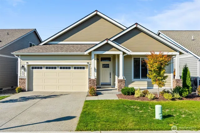 front view of a house with a yard