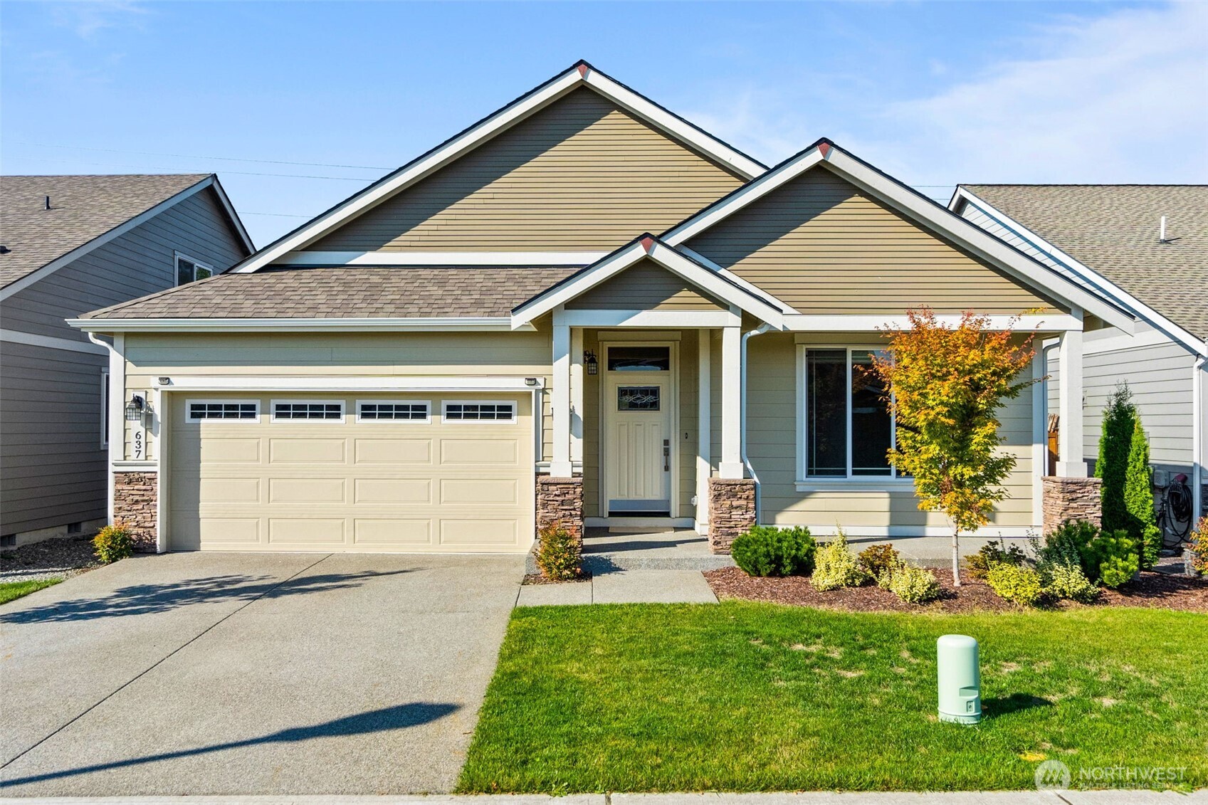 front view of a house with a yard