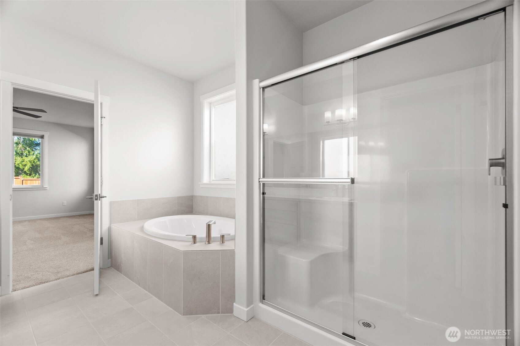 637 Maggee Street Southeast Lacey, WA 98513 - Photo 12 of 34 a bathroom with a bathtub and a shower