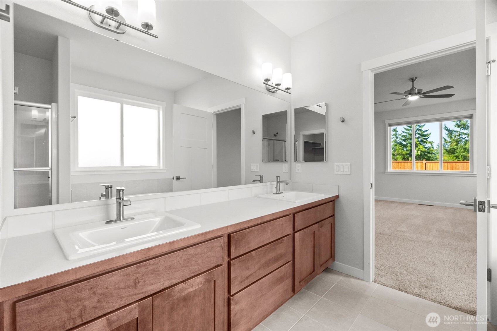 637 Maggee Street Southeast Lacey, WA 98513 - Photo 13 of 34 a bathroom with a double vanity sink and a mirror