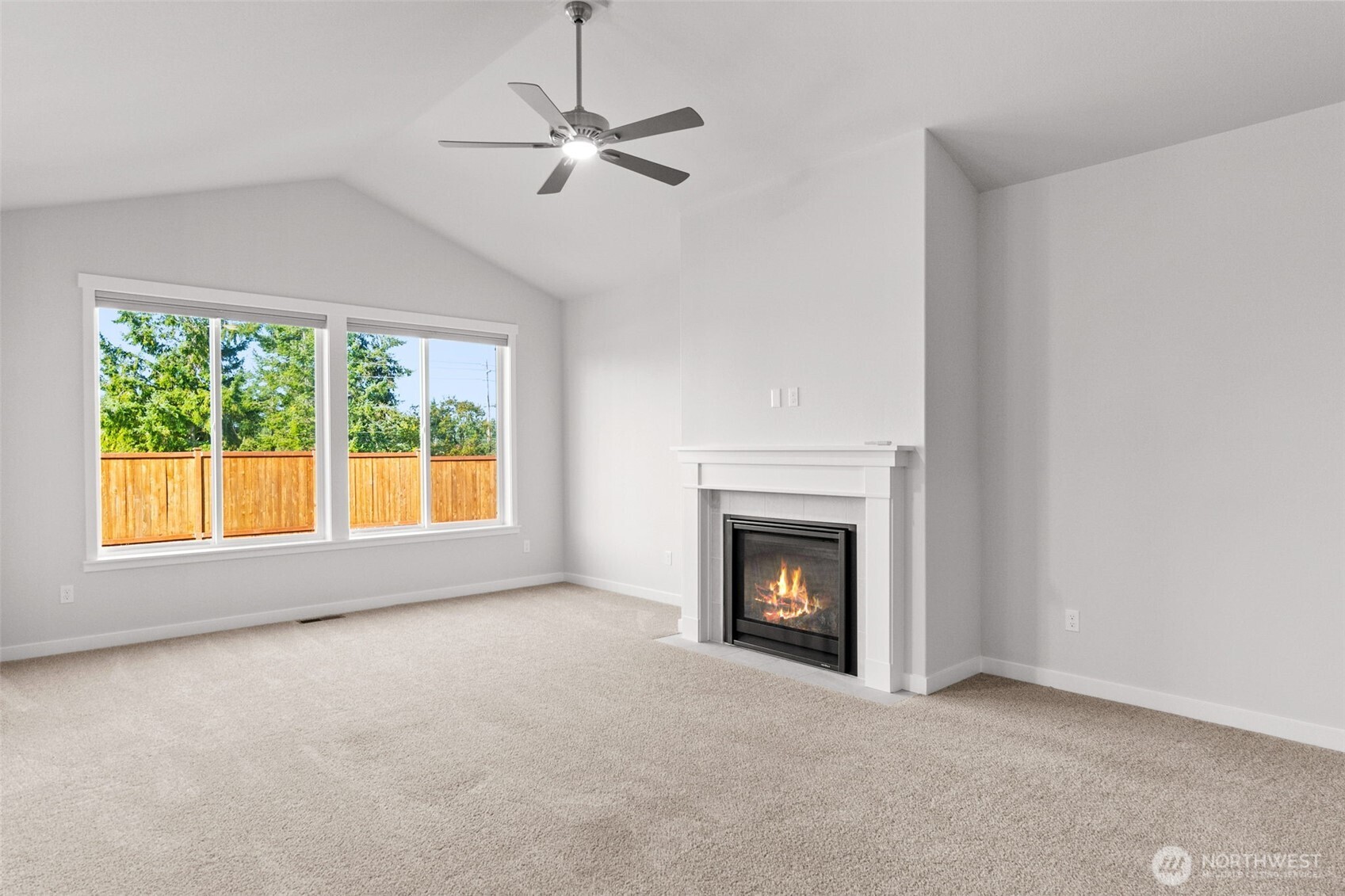 637 Maggee Street Southeast Lacey, WA 98513 - Photo 18 of 34 an empty room with fireplace fan and windows