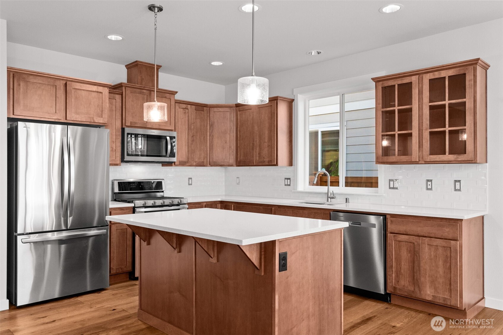 637 Maggee Street Southeast Lacey, WA 98513 - Photo 20 of 34 a kitchen with a sink stove and refrigerator