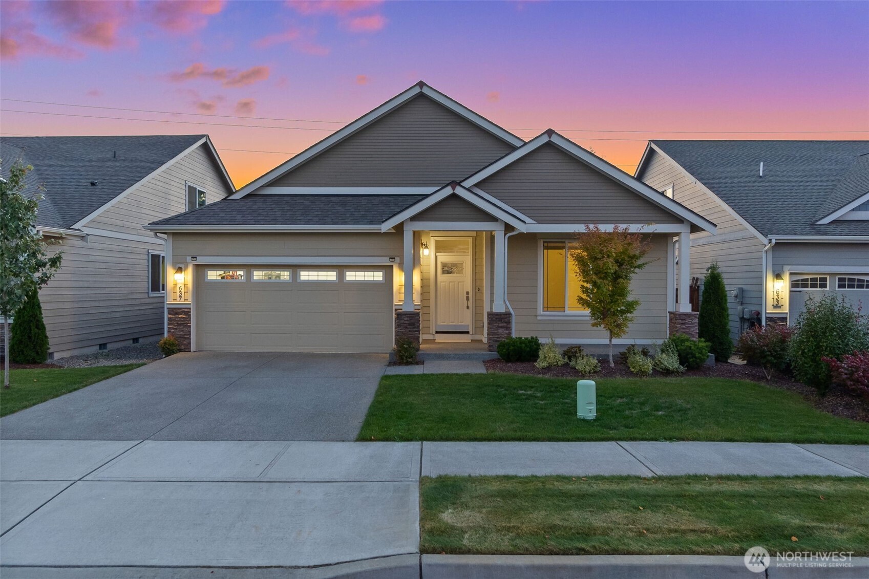 637 Maggee Street Southeast Lacey, WA 98513 - Photo 2 of 34 a front view of a house with a yard and garage