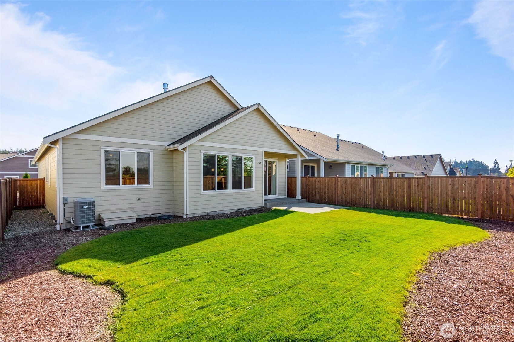 637 Maggee Street Southeast Lacey, WA 98513 - Photo 24 of 34 a view of a house with a yard and deck