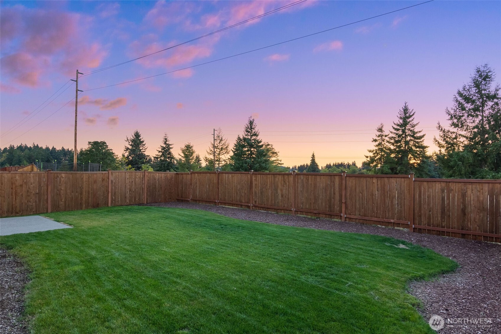637 Maggee Street Southeast Lacey, WA 98513 - Photo 28 of 34 a view of a backyard with wooden fence