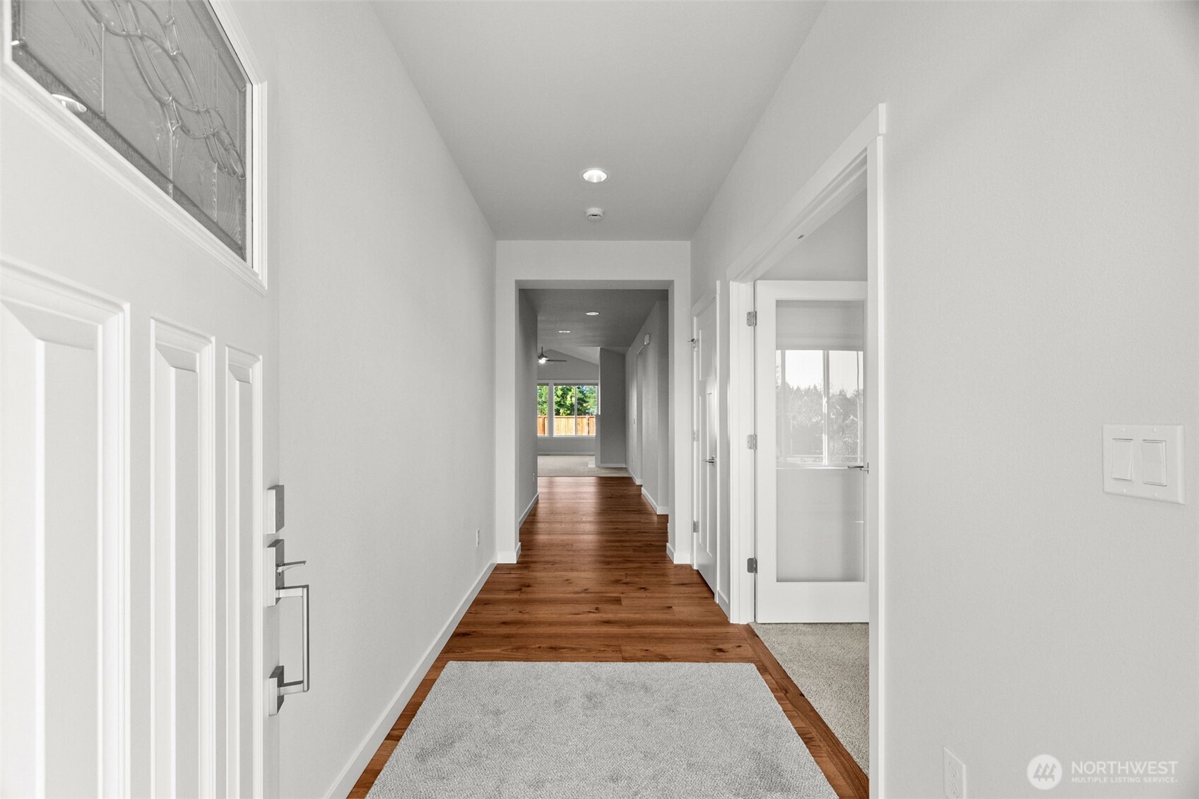 637 Maggee Street Southeast Lacey, WA 98513 - Photo 5 of 34 a view of a hallway with the wooden floor