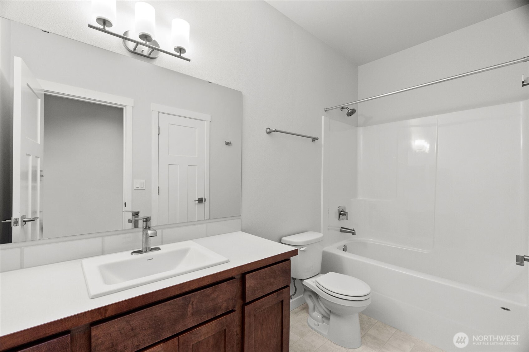 637 Maggee Street Southeast Lacey, WA 98513 - Photo 8 of 34 a bathroom with a sink a toilet and shower