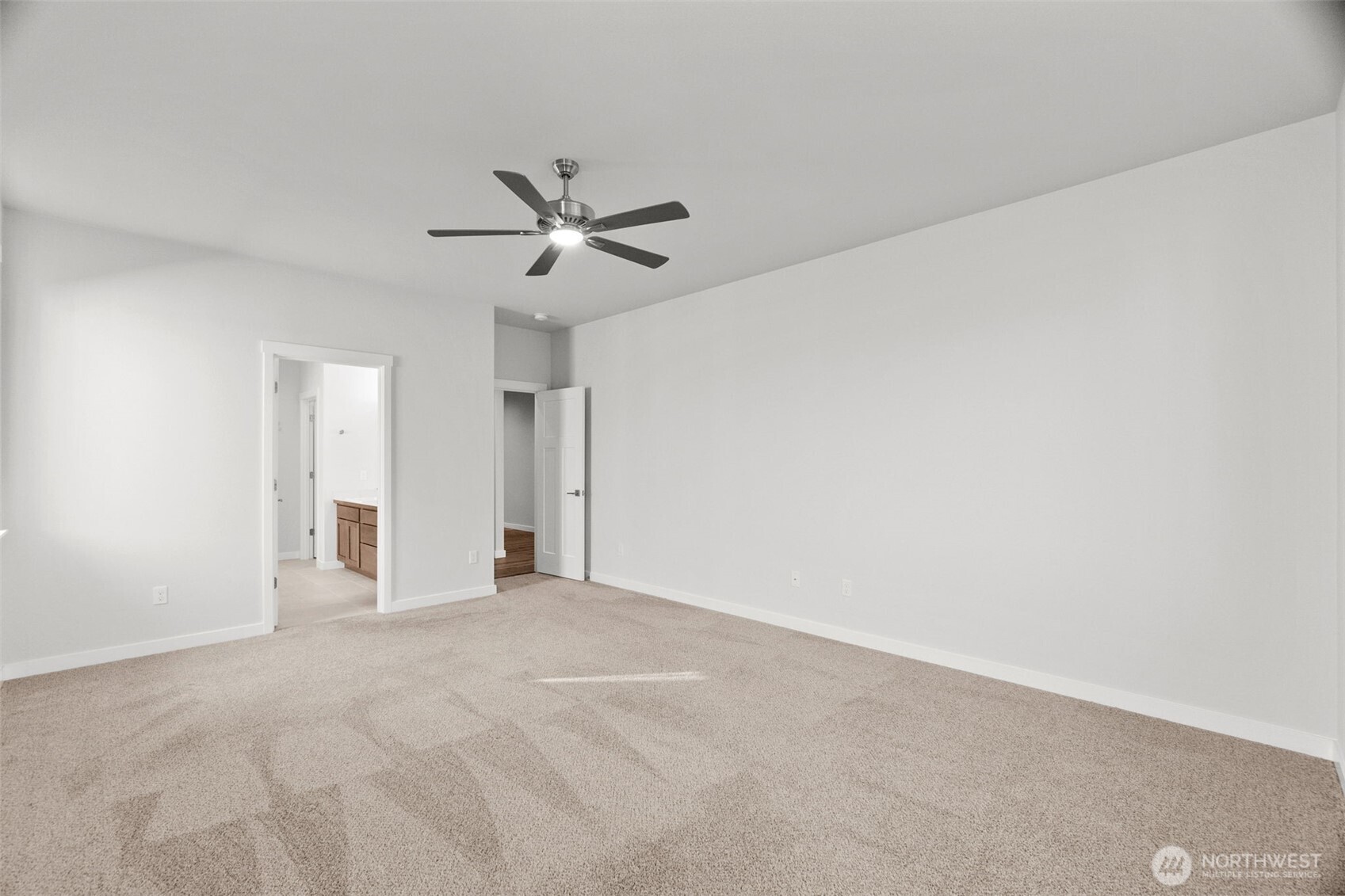 637 Maggee Street Southeast Lacey, WA 98513 - Photo 10 of 34 a view of an empty room with a ceiling fan