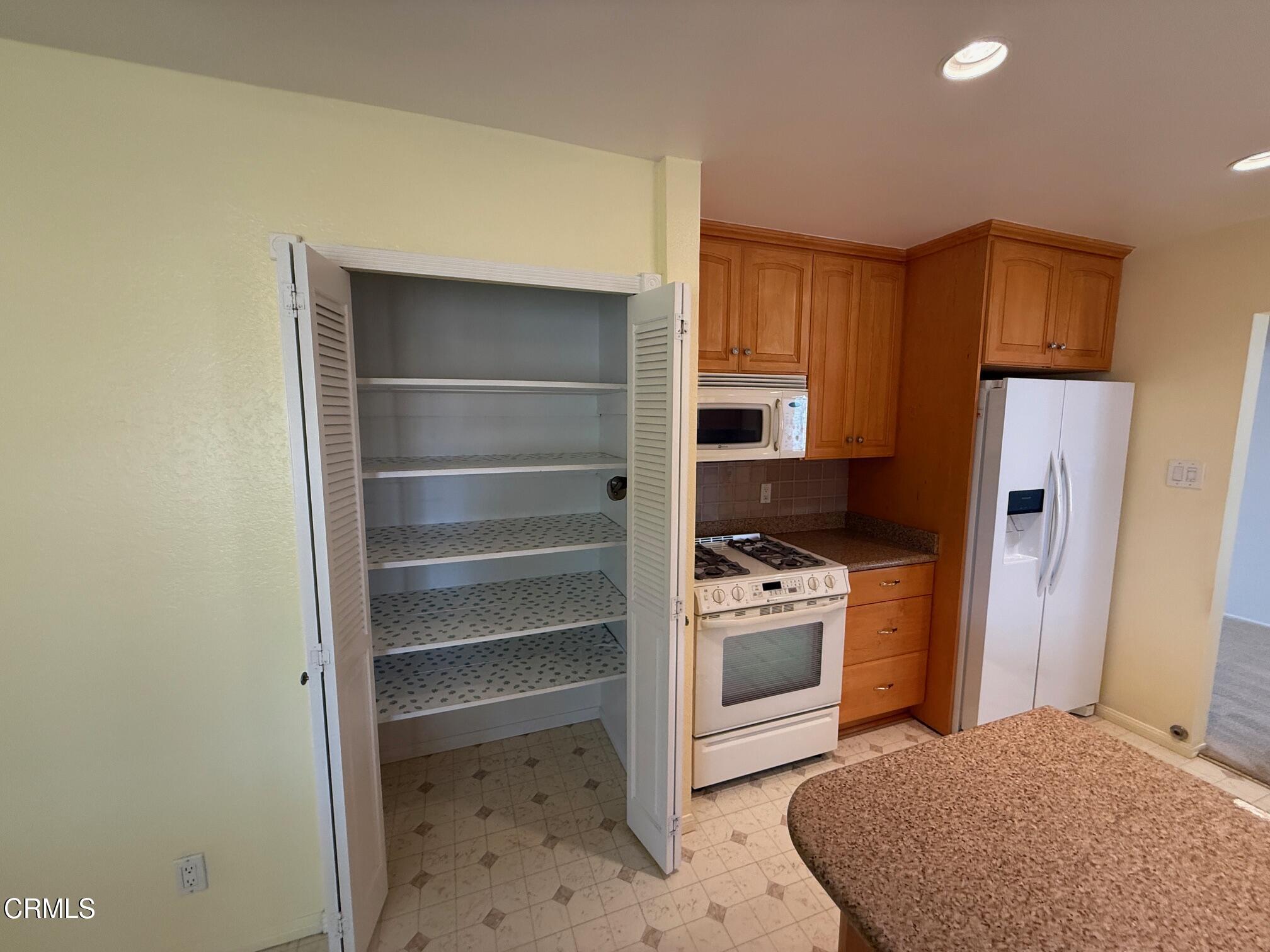 545 Pearson Road Port Hueneme, CA 93041 - Photo 12 of 19 a kitchen with a refrigerator and a stove