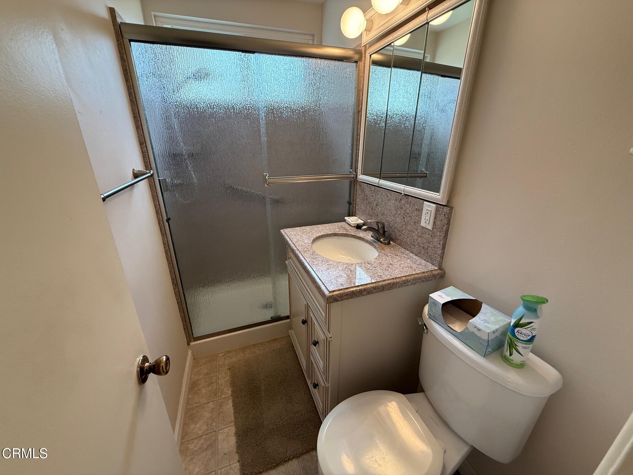 545 Pearson Road Port Hueneme, CA 93041 - Photo 13 of 19 a white toilet sitting next to a bathroom sink