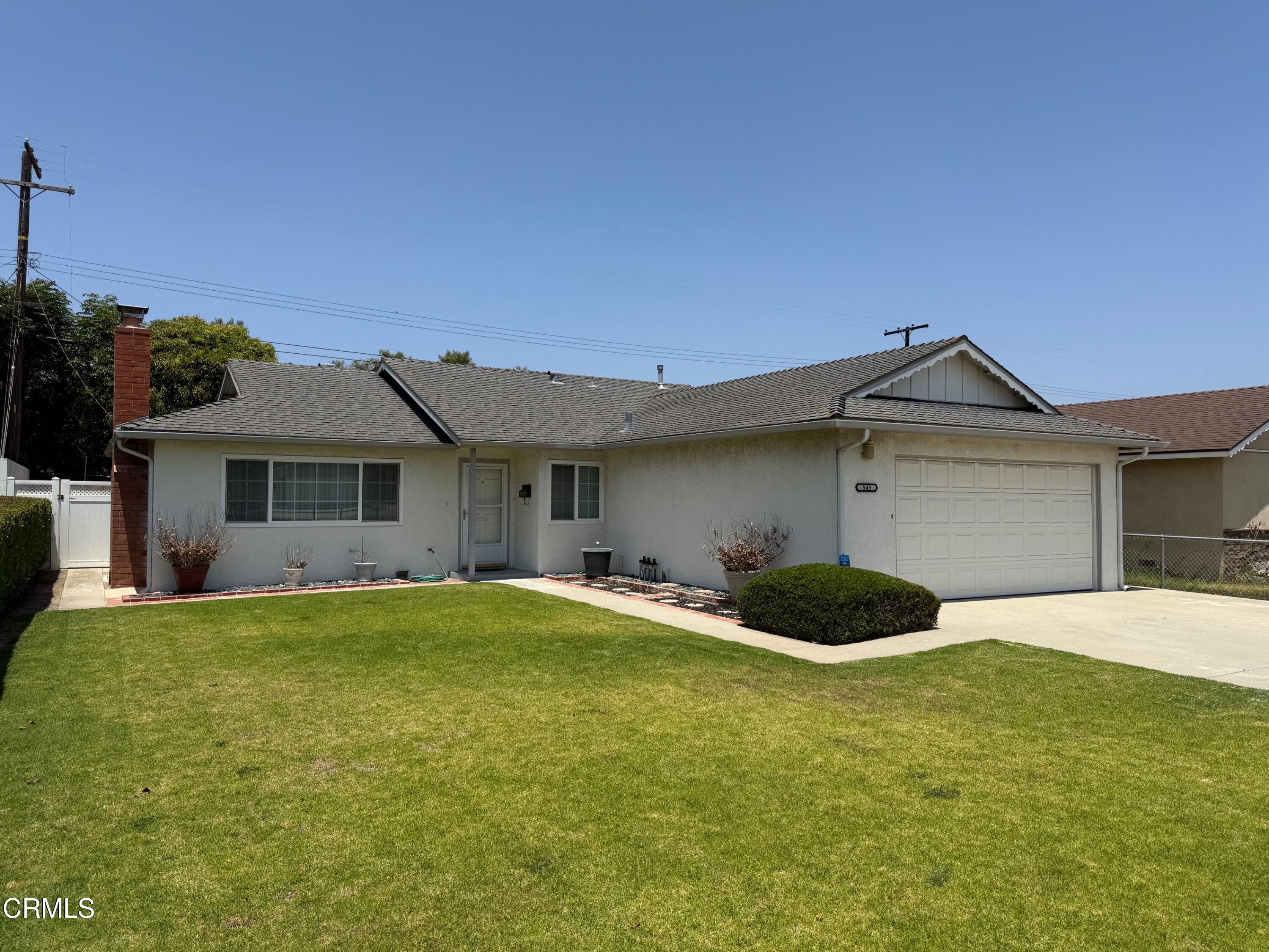 545 Pearson Road Port Hueneme, CA 93041 - Photo 3 of 19 a front view of a house with a yard and garage