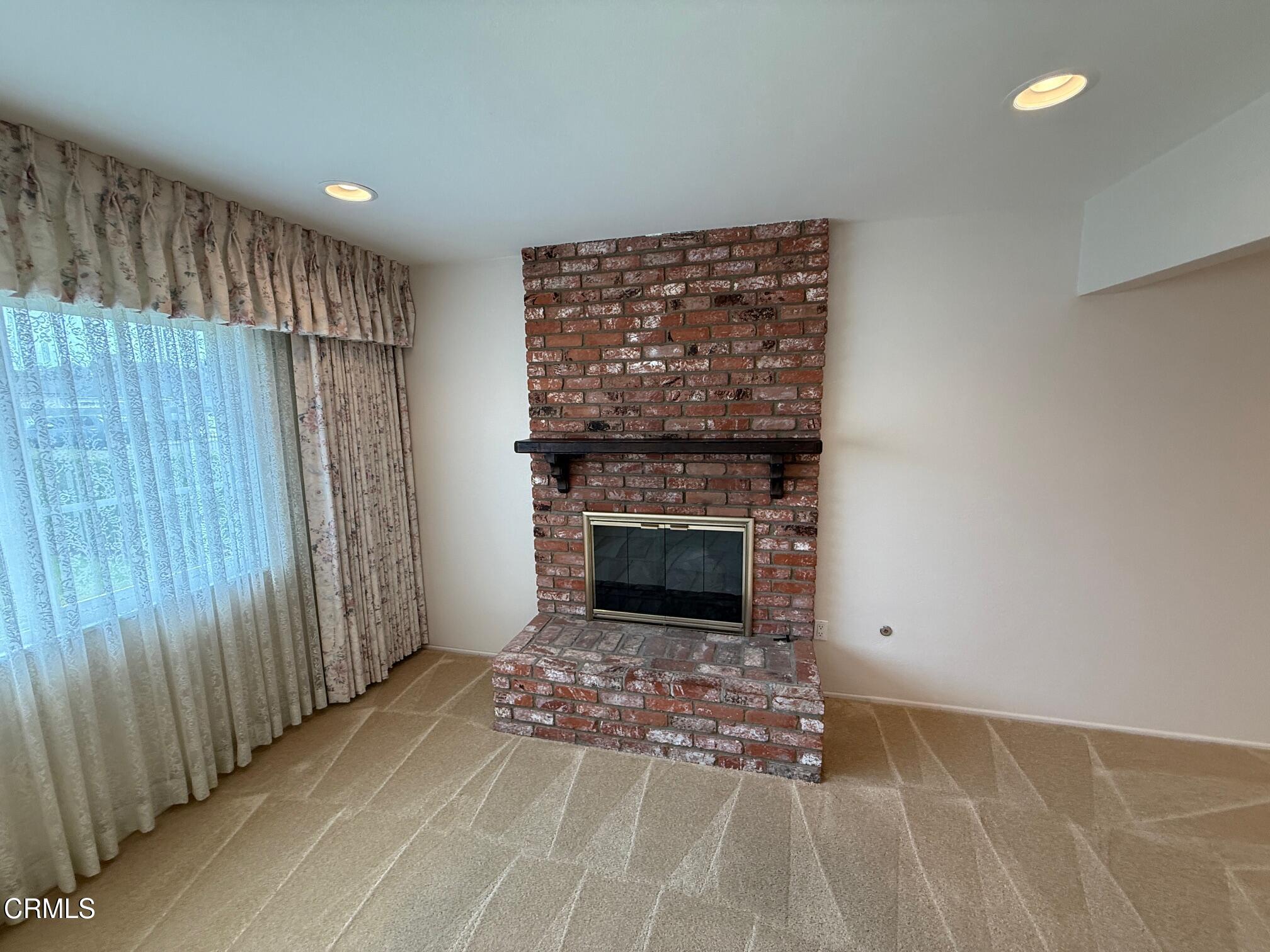 545 Pearson Road Port Hueneme, CA 93041 - Photo 8 of 19 a view of a livingroom with a fireplace and window