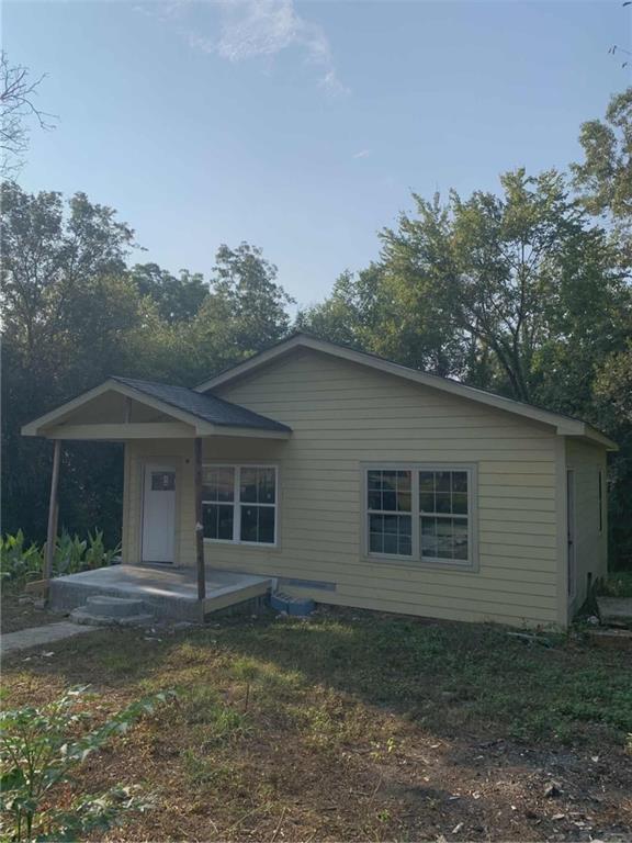 1066 Jessamine Drive Macon, GA 31206 - Photo 15 of 17 a house with trees in the background