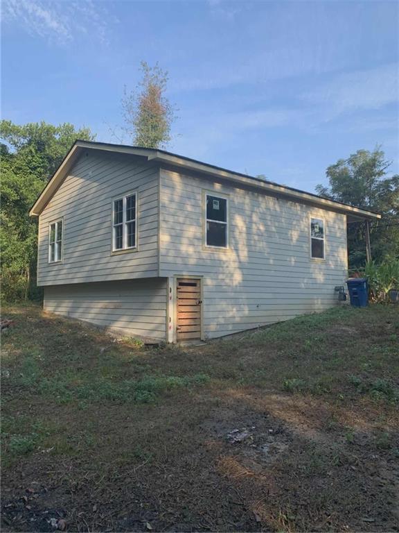 1066 Jessamine Drive Macon, GA 31206 - Photo 16 of 17 a backyard of a house with lots of green space