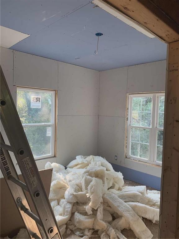 1066 Jessamine Drive Macon, GA 31206 - Photo 10 of 17 a bedroom with a bed and a window