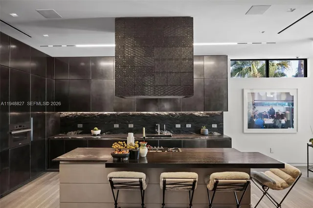 a bedroom with a bed and chandelier