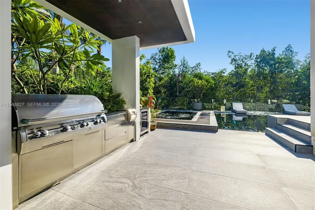 a bedroom with a white bed and a couch