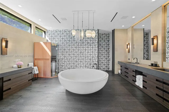 a view of backyard with table and chairs and potted plants