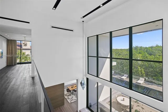 an aerial view of a house with outdoor space and a lake view