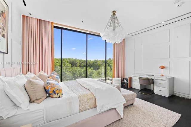 an aerial view of a house with outdoor space and a lake view