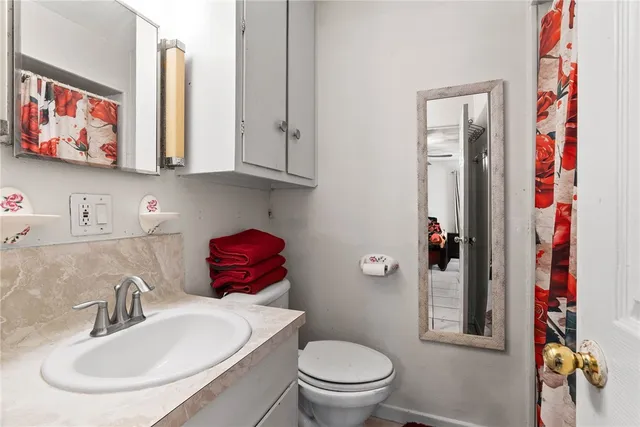 a bathroom with a toilet and a sink