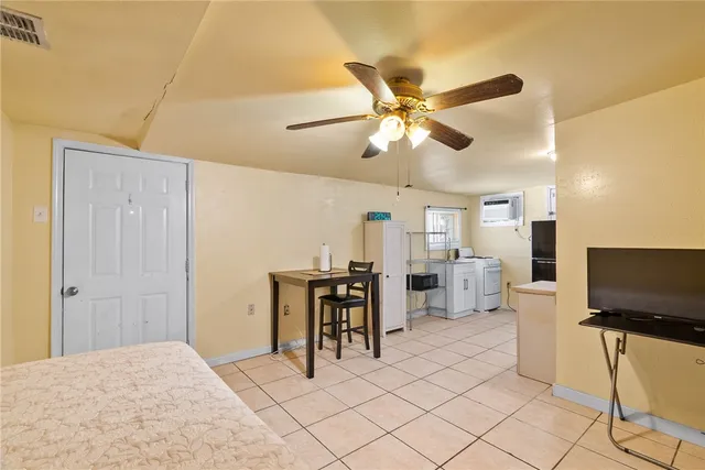 a view of a livingroom with furniture and a flat screen tv