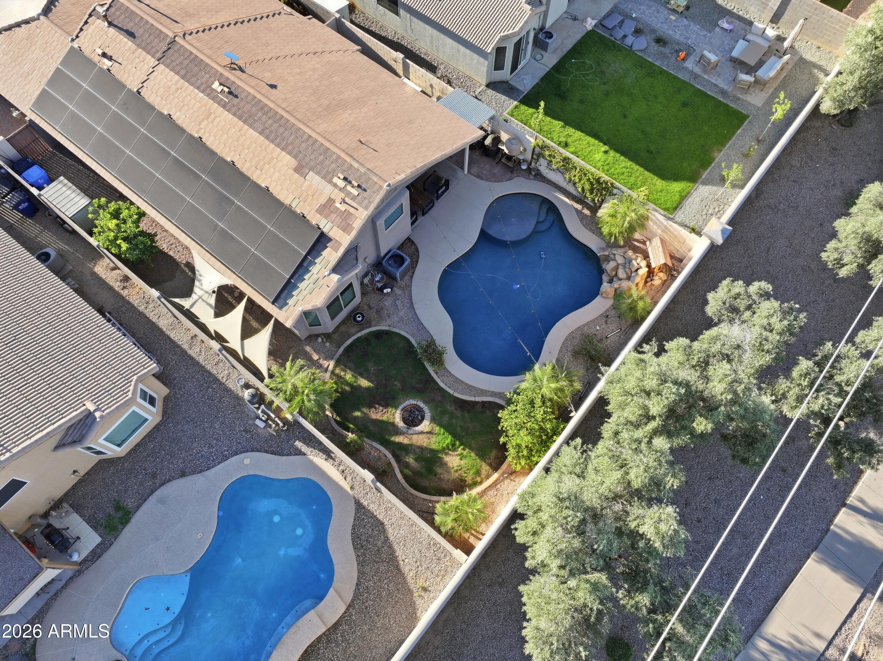 661 North Joshua Tree Lane Gilbert, AZ 85234 - Photo 38 of 47 an aerial view of a house with garden space and street view