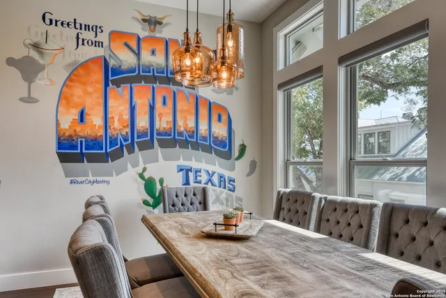 a bedroom with furniture and a large window