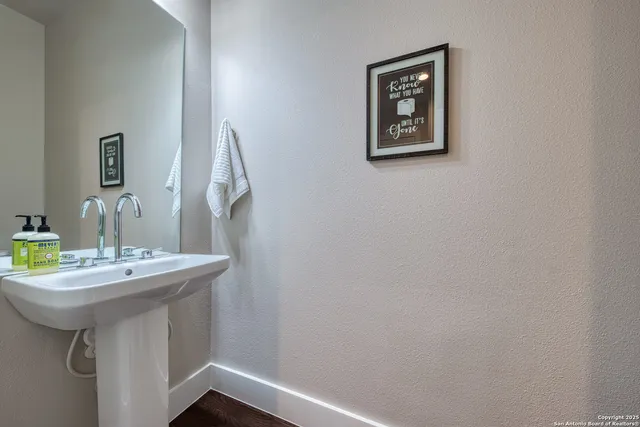 a bathroom with a sink and a mirror