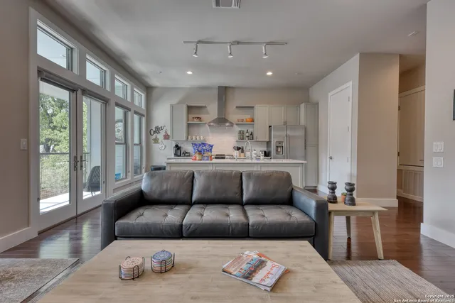 a living room with furniture and a large window