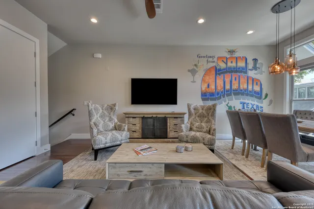 a living room with furniture and a flat screen tv