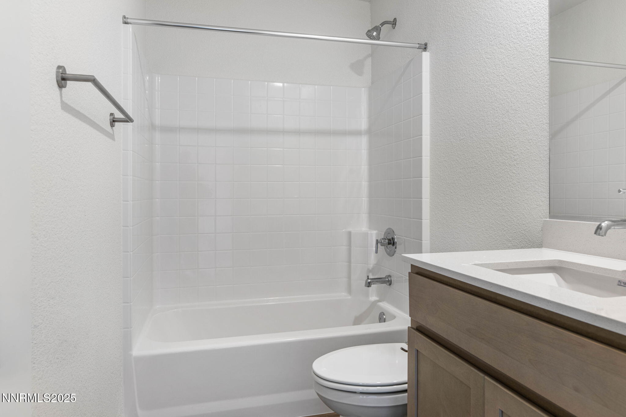 345 Halite Drive Dayton, NV 89403 - Photo 16 of 24 a bathroom with a sink a toilet and a bathtub