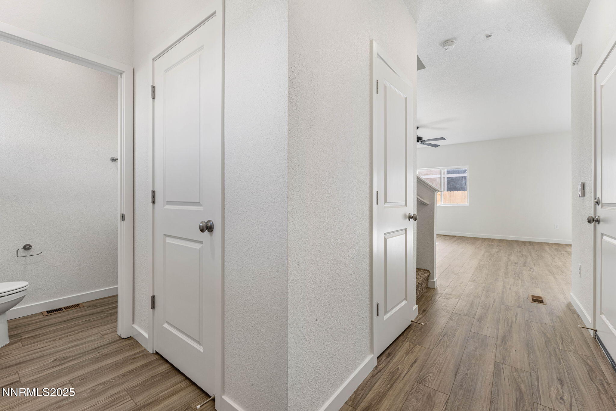 345 Halite Drive Dayton, NV 89403 - Photo 7 of 24 a view of a hallway with wooden floor