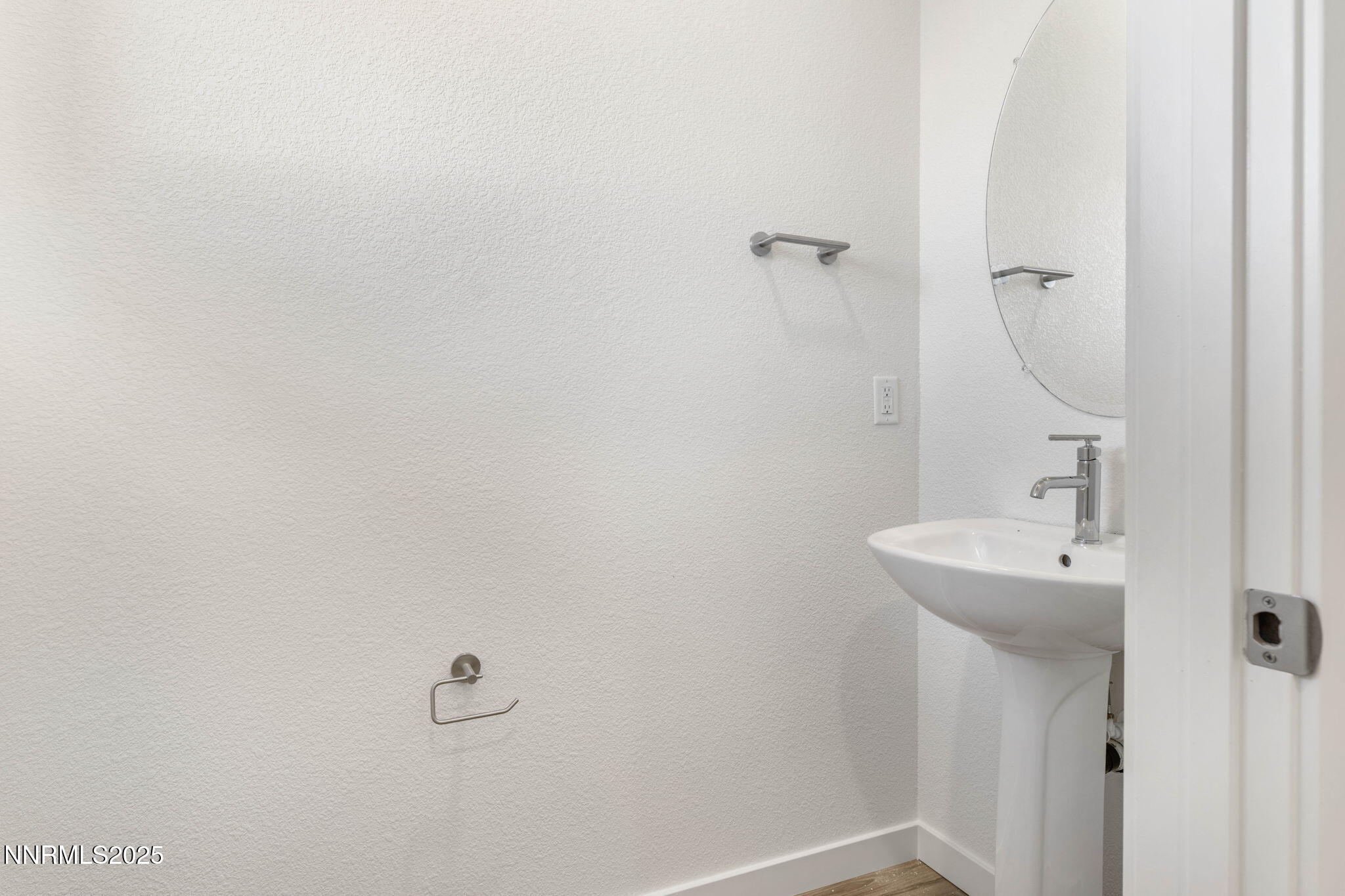 345 Halite Drive Dayton, NV 89403 - Photo 8 of 24 a bathroom with a sink and mirror
